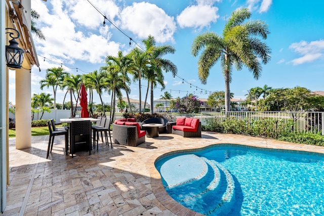 view of pool with a patio and outdoor lounge area