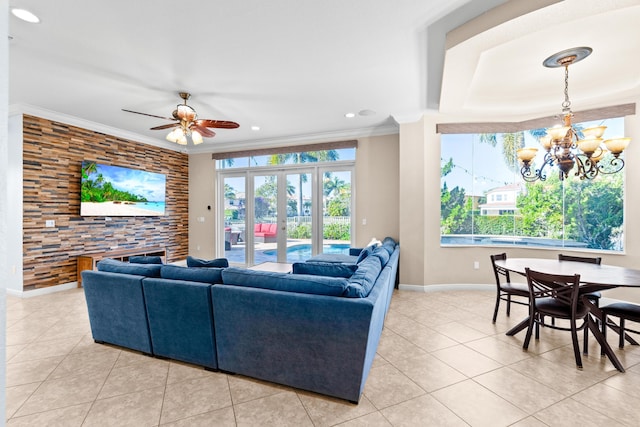 tiled living room featuring ceiling fan with notable chandelier, french doors, and crown molding