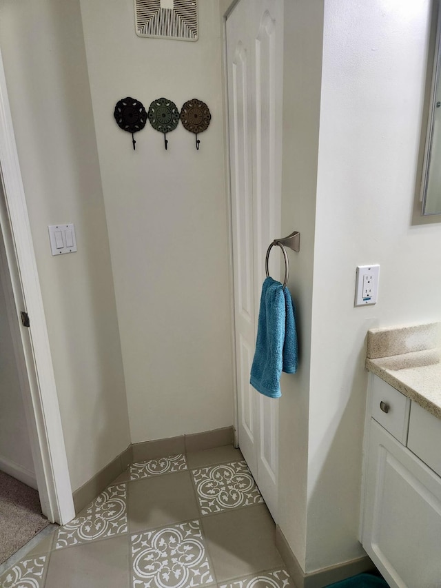 bathroom with vanity and tile patterned flooring