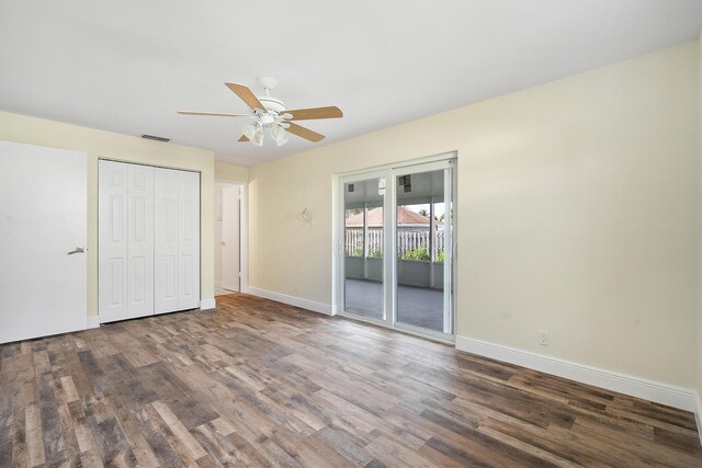 7423 SE James St, Hobe Sound, FL 33455 - unfurnished bedroom featuring baseboards, visible vents, wood finished floors, and a closet