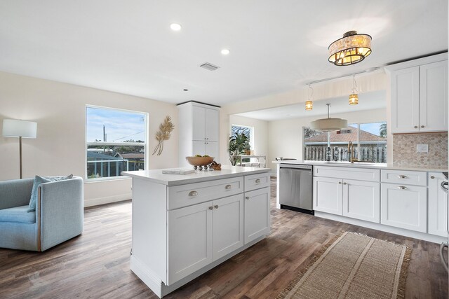 7423 SE James St, Hobe Sound, FL 33455 - dining room with dark wood-type flooring, baseboards, and visible vents