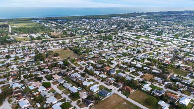7423 SE James St, Hobe Sound, FL 33455 - view of front of property with stucco siding, a front yard, and metal roof