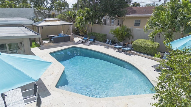 view of pool featuring a fenced in pool, a patio, a hot tub, a fenced backyard, and an outdoor living space