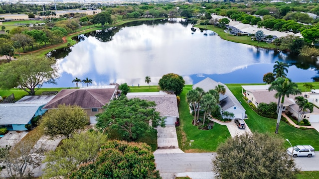 drone / aerial view with a residential view and a water view