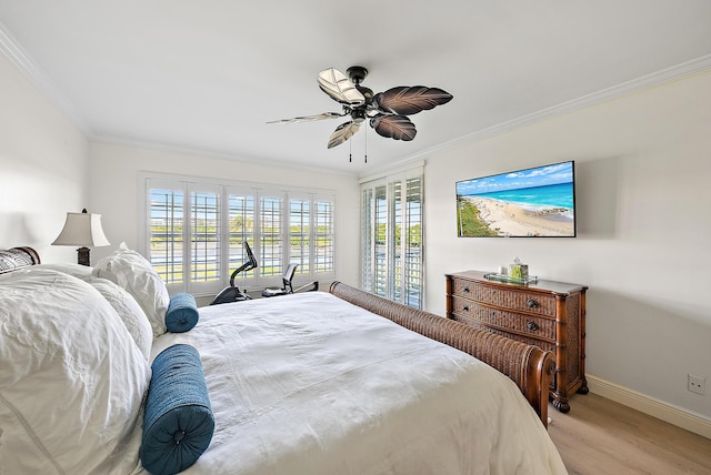 bedroom featuring multiple windows, ornamental molding, and light hardwood / wood-style flooring