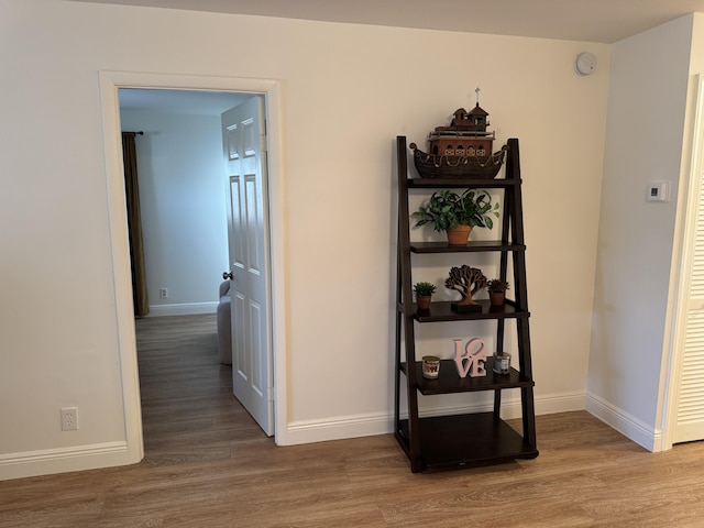 corridor featuring hardwood / wood-style floors