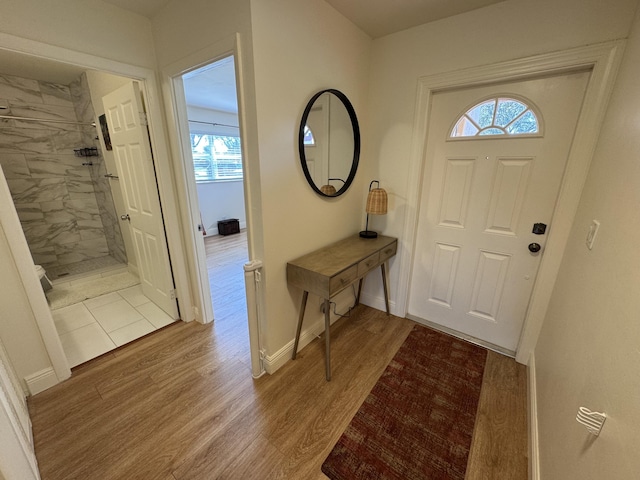 entryway with hardwood / wood-style floors