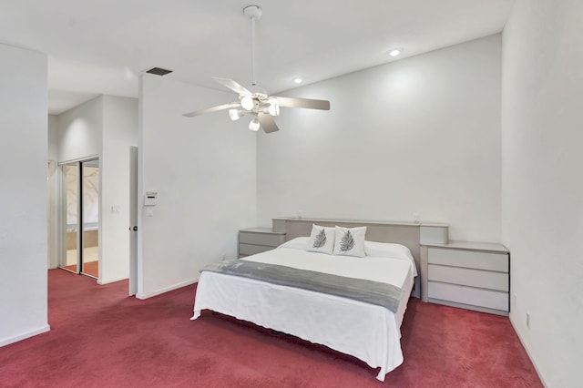 bedroom with dark colored carpet and ceiling fan