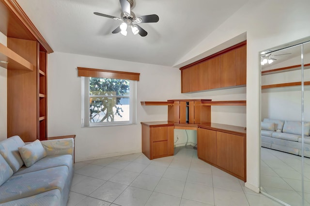 tiled office with ceiling fan and built in desk