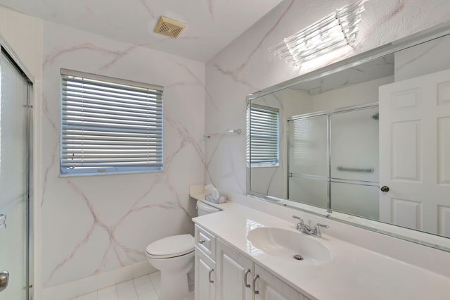 bathroom featuring toilet, an enclosed shower, and vanity