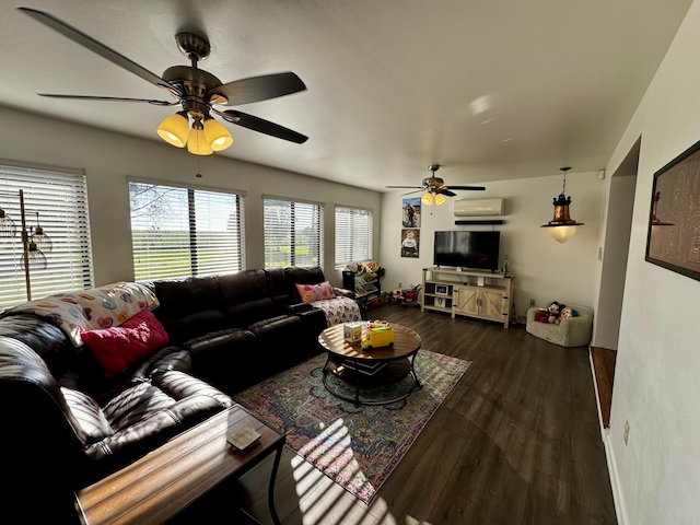 living room with dark wood-type flooring and an AC wall unit