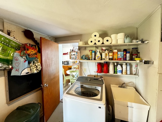 laundry area featuring washer / dryer and sink