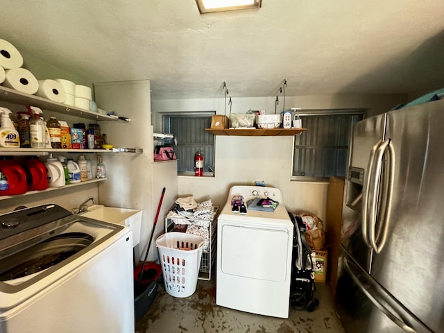 laundry room with independent washer and dryer