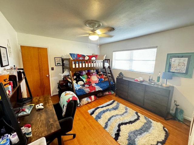 bedroom featuring wood-type flooring and ceiling fan