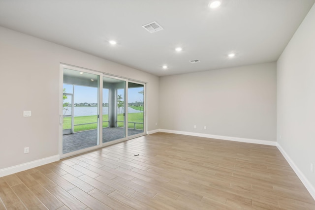 unfurnished room featuring light wood-type flooring