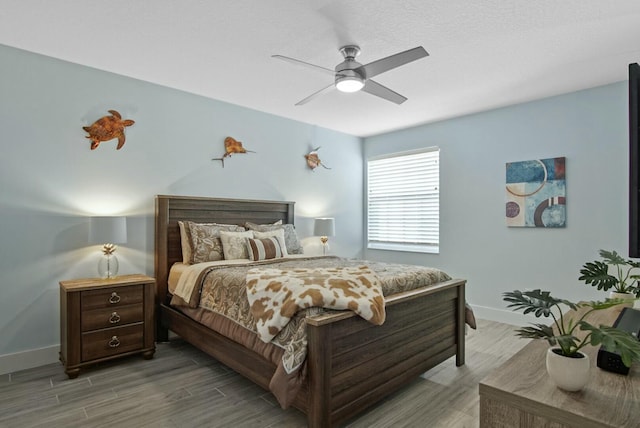 bedroom featuring hardwood / wood-style flooring and ceiling fan