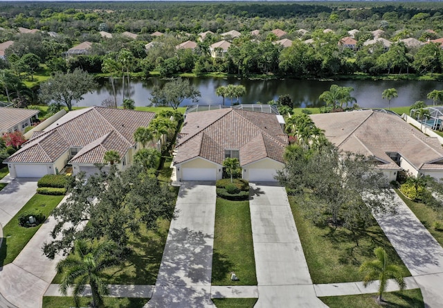 birds eye view of property featuring a water view