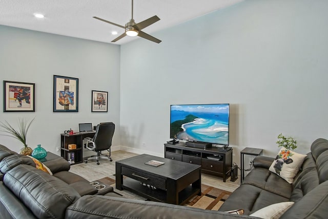 living room with ceiling fan and light wood-type flooring