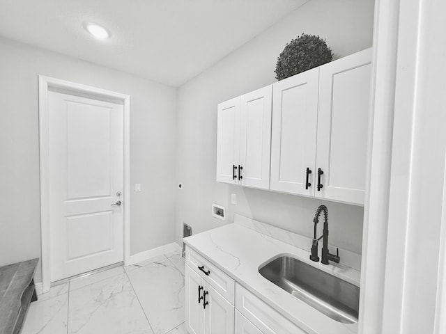 washroom featuring washer hookup, a sink, marble finish floor, cabinet space, and electric dryer hookup