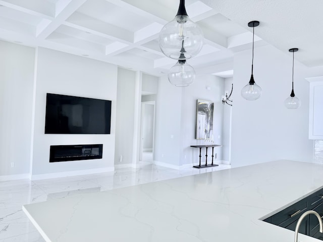 interior space with marble finish floor, coffered ceiling, and open floor plan