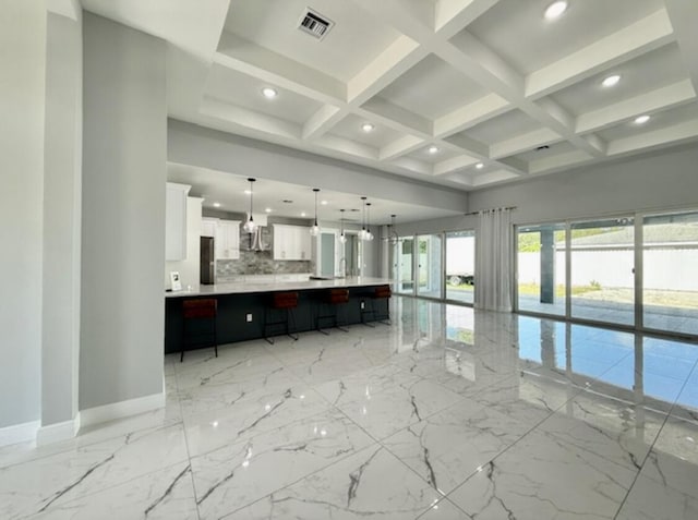 unfurnished living room with visible vents, marble finish floor, beamed ceiling, baseboards, and recessed lighting
