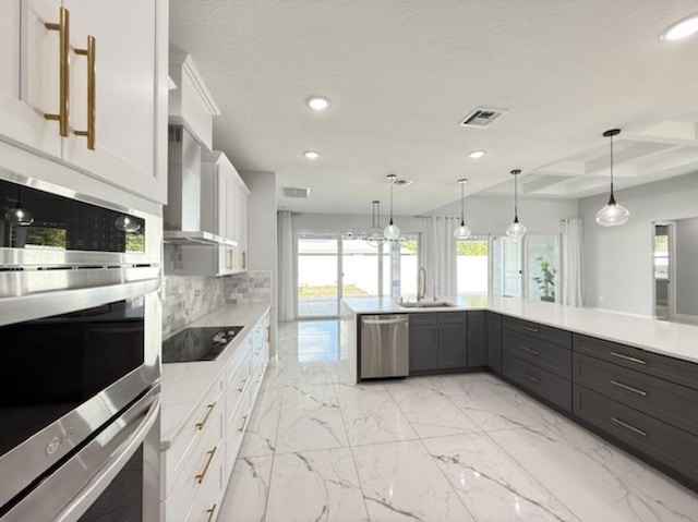 kitchen featuring stainless steel dishwasher, visible vents, black electric stovetop, wall chimney range hood, and recessed lighting