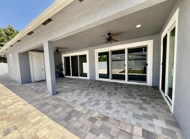 view of patio featuring ceiling fan