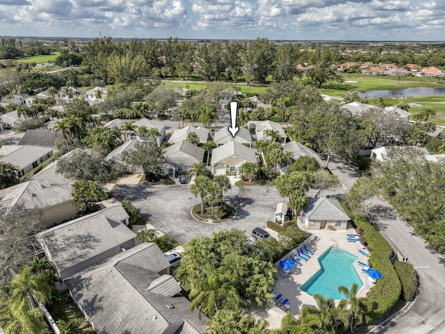 birds eye view of property with a water view