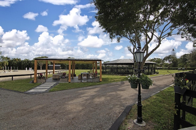 surrounding community featuring a lawn and a gazebo