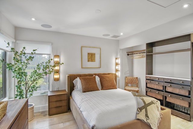 bedroom featuring recessed lighting, visible vents, and light wood-style floors