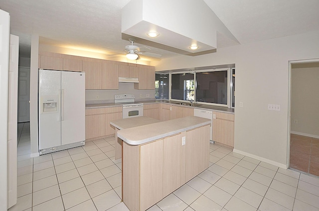 kitchen with sink, white appliances, light tile patterned floors, a center island, and light brown cabinetry