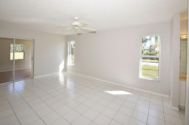 tiled empty room with ceiling fan