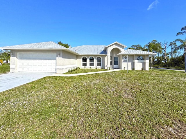 single story home featuring a garage and a front lawn