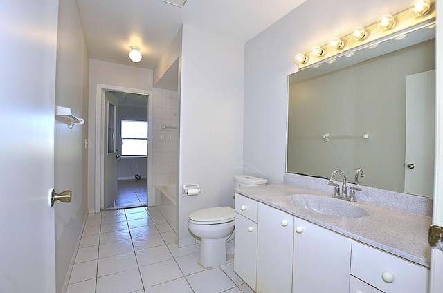 bathroom featuring tile patterned flooring, vanity, and toilet