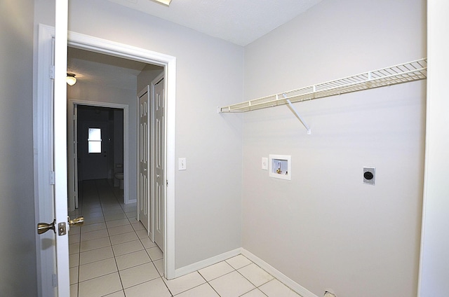 washroom with light tile patterned flooring, electric dryer hookup, and washer hookup