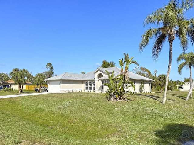 single story home with a garage and a front yard