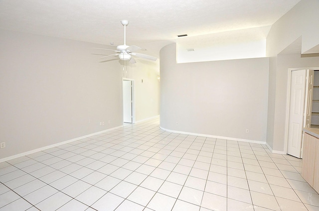 unfurnished room featuring ceiling fan and vaulted ceiling