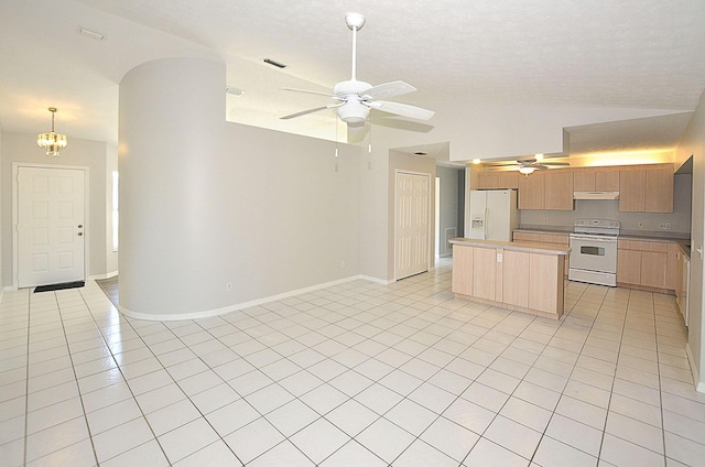 kitchen with light tile patterned flooring, lofted ceiling, a center island, white appliances, and ceiling fan with notable chandelier