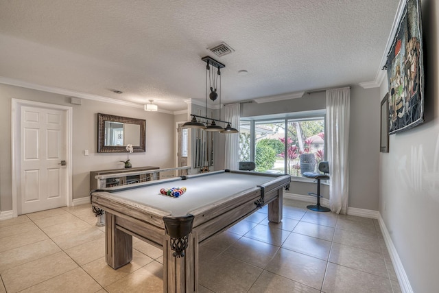 game room featuring light tile patterned floors, a textured ceiling, billiards, and ornamental molding