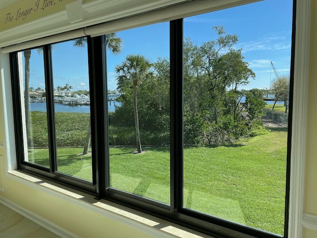 doorway to outside featuring a water view