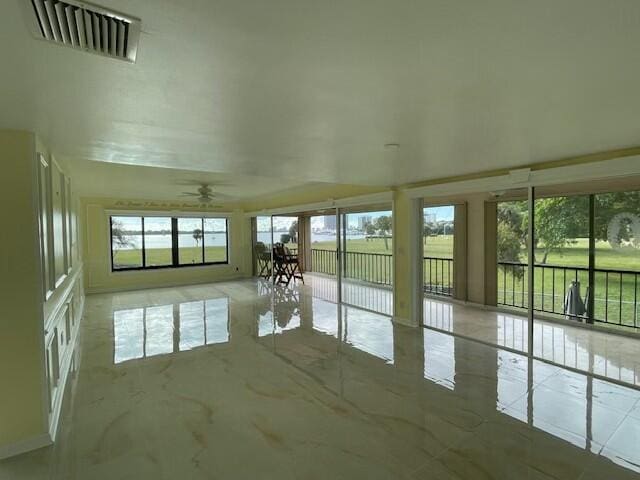 unfurnished sunroom with visible vents