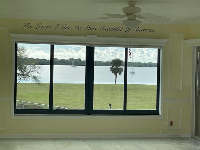 unfurnished sunroom with a water view and a wealth of natural light