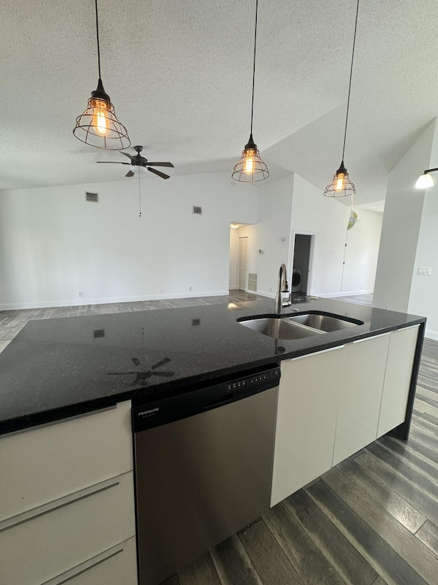 kitchen with hanging light fixtures, stainless steel dishwasher, and white cabinets