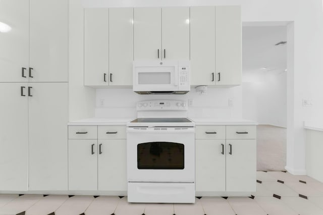 kitchen with white appliances and white cabinets