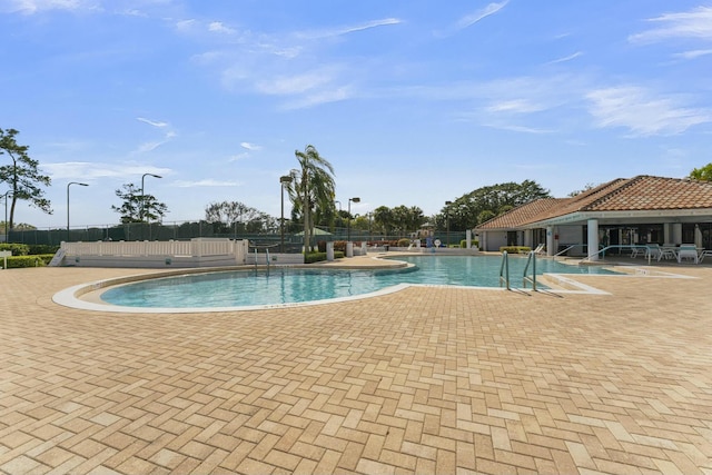 view of swimming pool featuring a patio area