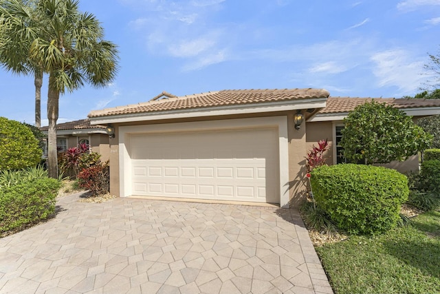 mediterranean / spanish house featuring a garage