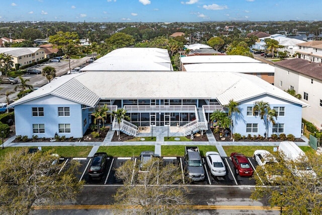 birds eye view of property with a residential view