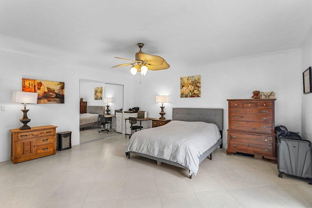 bedroom with a ceiling fan and crown molding