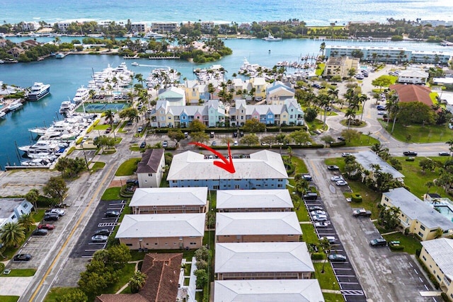 birds eye view of property featuring a residential view and a water view