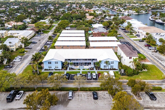 birds eye view of property featuring a residential view and a water view